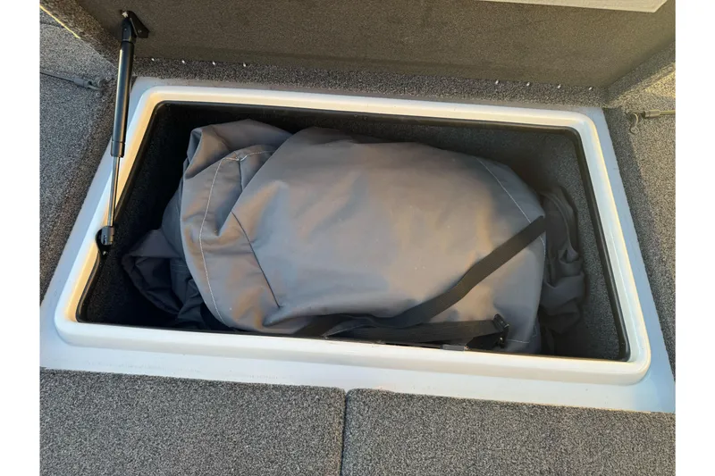 Slide: The Image of Storage compartment in a 2011 Nitro Z-9 DC boat with a gray bag inside. - 30
