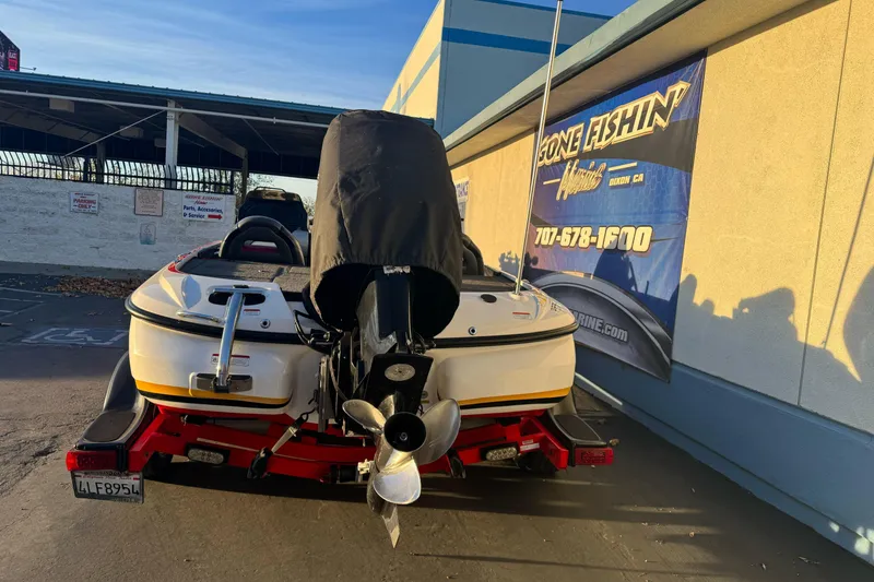 Slide: The Image of 2011 Nitro Z-9 DC boat on trailer, parked near a marine service center. - 5
