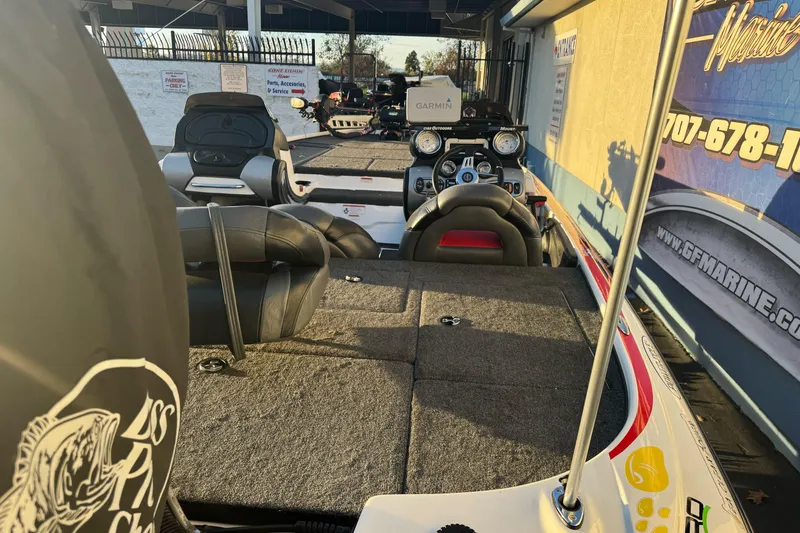 Slide: The Image of 2011 Nitro Z-9 DC boat interior with seating and control panel, displayed at a marine dealership. - 6