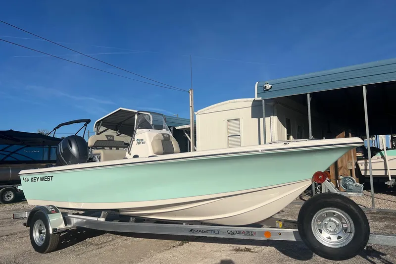 The Image of 2026 Key West 188 Bay Reef boat on trailer under clear blue sky. - 1