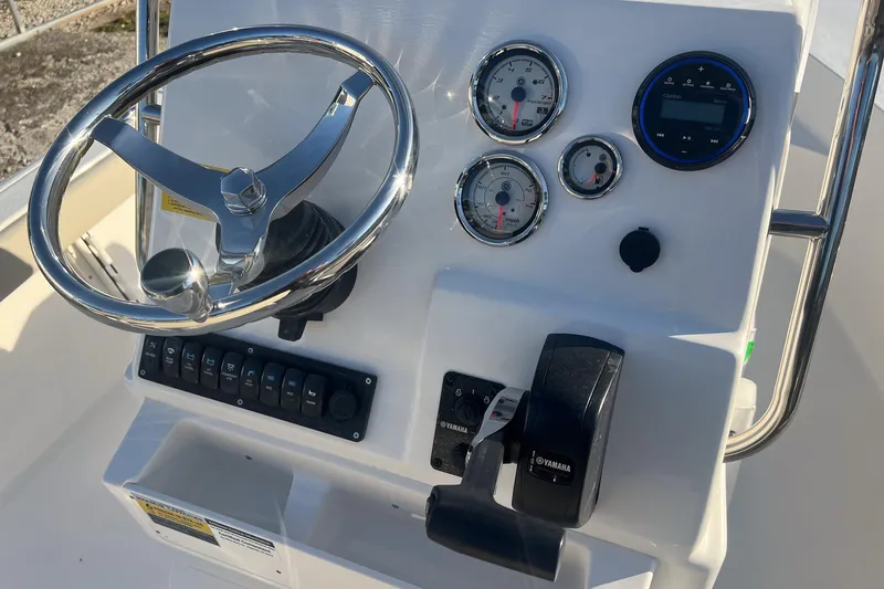 Slide: The Image of Steering console of 2026 Key West 188 Bay Reef boat with gauges and controls. - 12