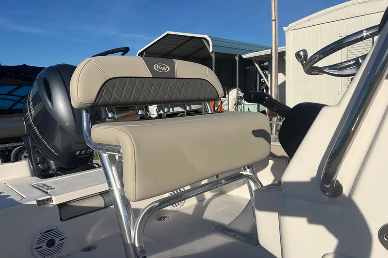 Slide: The Image of 2026 Key West 188 Bay Reef boat interior with Yamaha engine and cushioned seating. - 4