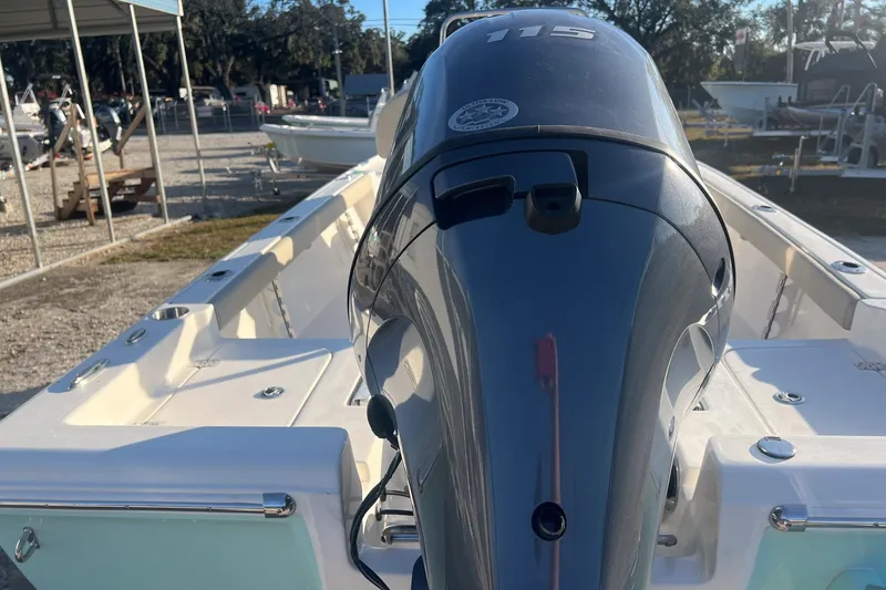Slide: The Image of 2026 Key West 188 Bay Reef boat with powerful outboard motor in a marina setting. - 6