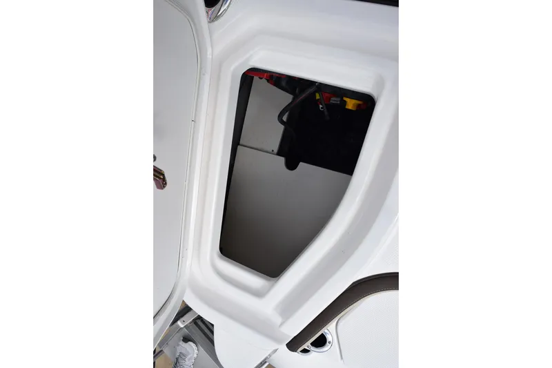 Slide: The Image of 2026 Yamaha Boats 255 FSH Sport H storage compartment detail. - 25