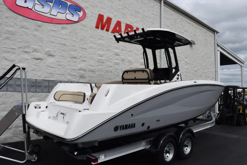 Slide: The Image of 2026 Yamaha Boats 255 FSH Sport H on trailer at dealership. - 4