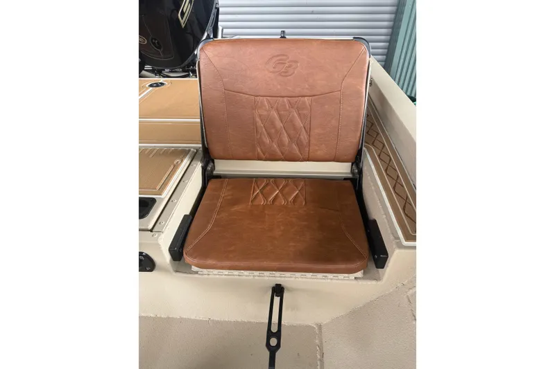 Slide: The Image of Brown leather seat on 2026 G3 Bay 21 GX boat, featuring diamond stitching. - 11