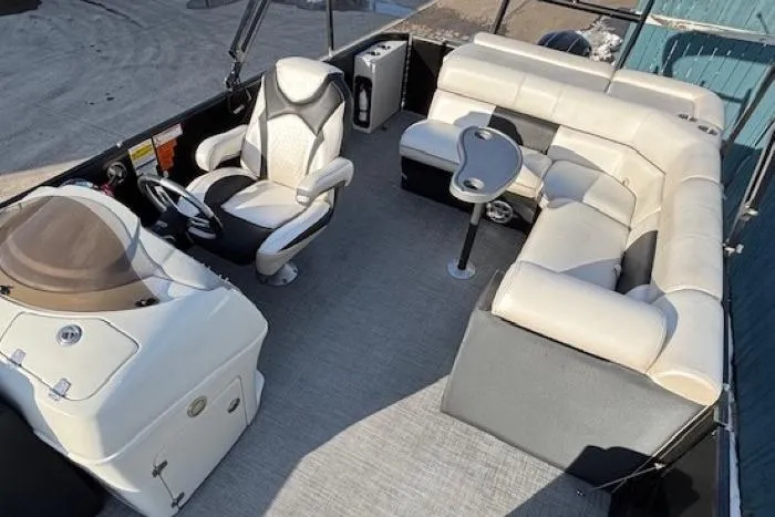 Slide: The Image of 2016 Southbay 523CR Super Sport Tri-Toon interior with plush seating and modern helm. - 14