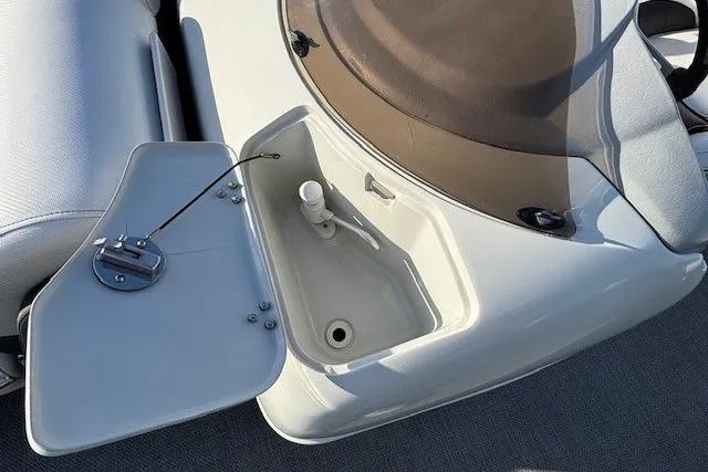 Slide: The Image of 2016 Southbay 523CR Super Sport Tri-Toon boat detail with open storage compartment. - 16