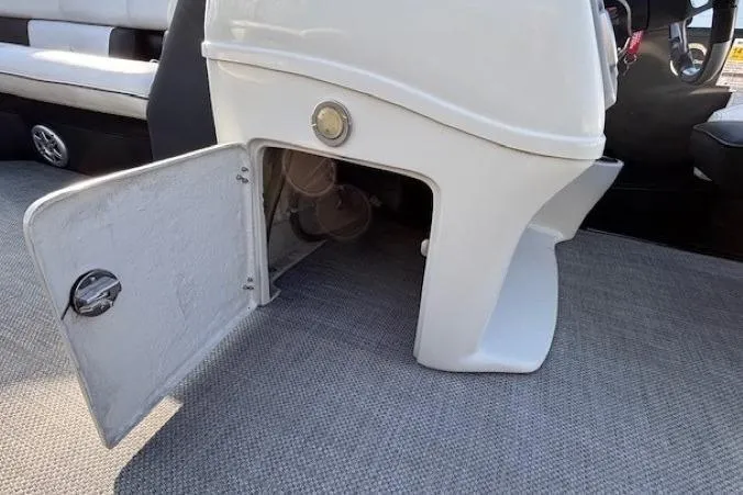 Slide: The Image of 2016 Southbay 523CR Super Sport Tri-Toon interior storage compartment with open door. - 17