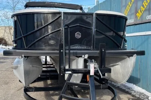 Slide: The Image of 2016 Southbay 523CR Super Sport Tri-Toon boat on trailer, front view. - 2