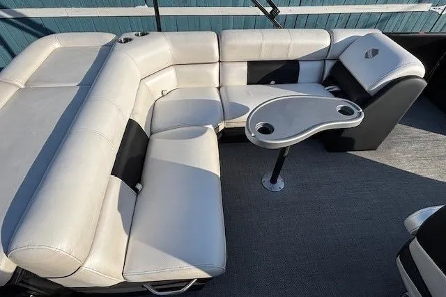 Slide: The Image of Luxurious seating on 2016 Southbay 523CR Super Sport Tri-Toon boat with table and cup holders. - 22