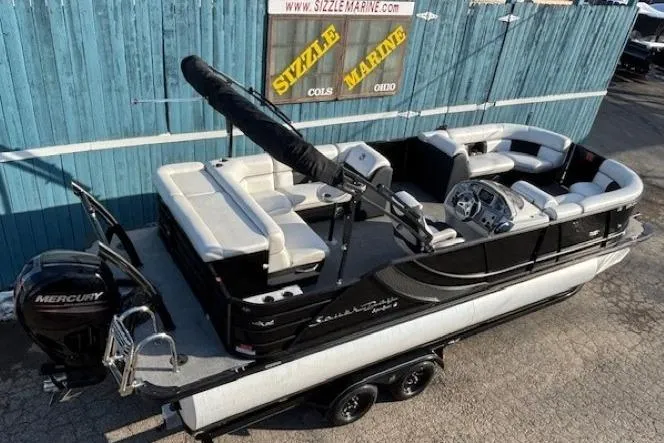 Slide: The Image of 2016 Southbay 523CR Super Sport Tri-Toon boat with Mercury engine on trailer. - 6