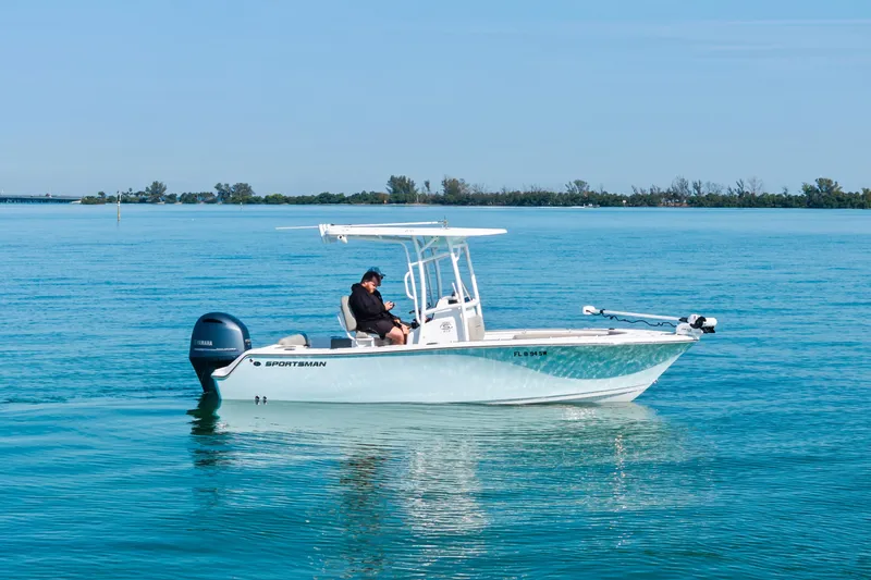 The Image of 2021 Sportsman Open 212 Center Console boat on calm blue water. - 0