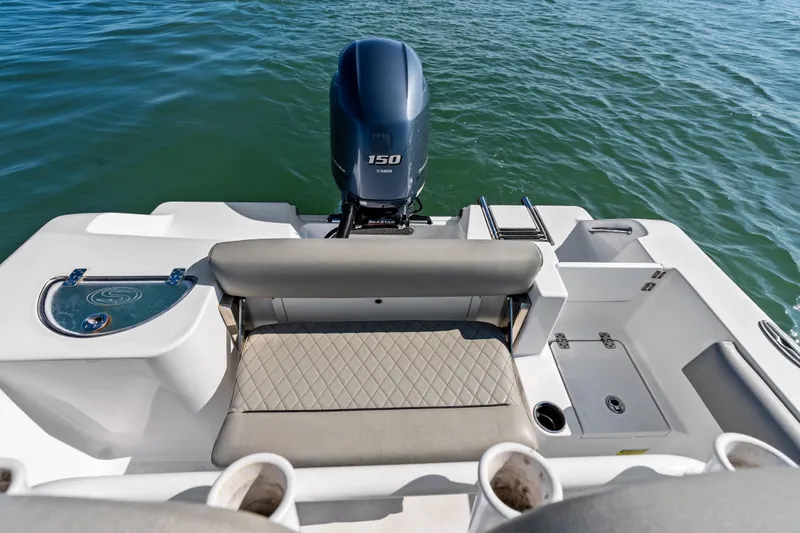 Slide: The Image of 2021 Sportsman Open 212 Center Console boat with Yamaha 150 engine on water. - 16