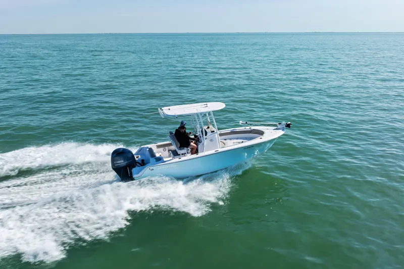 Slide: The Image of 2021 Sportsman Open 212 Center Console boat cruising on open water. - 3