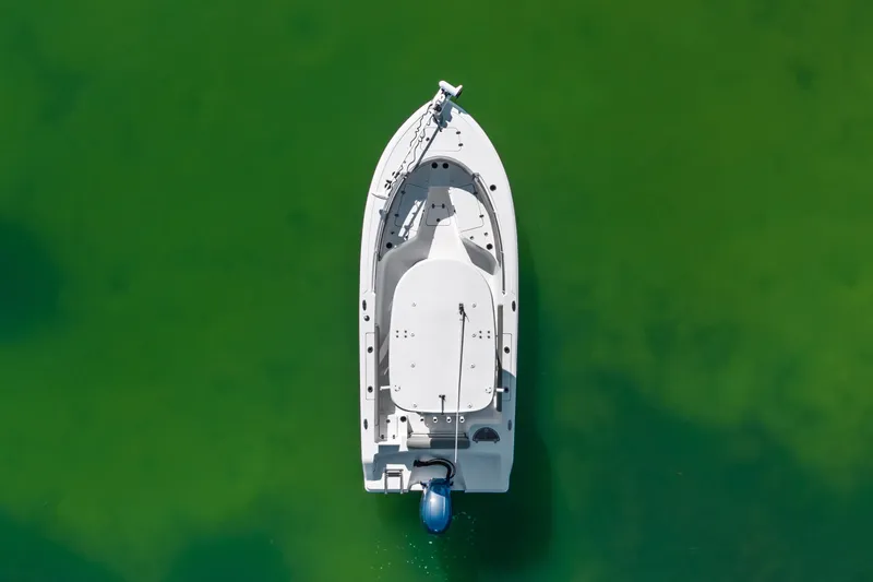 Slide: The Image of Aerial view of 2021 Sportsman Open 212 Center Console boat on green water. - 5