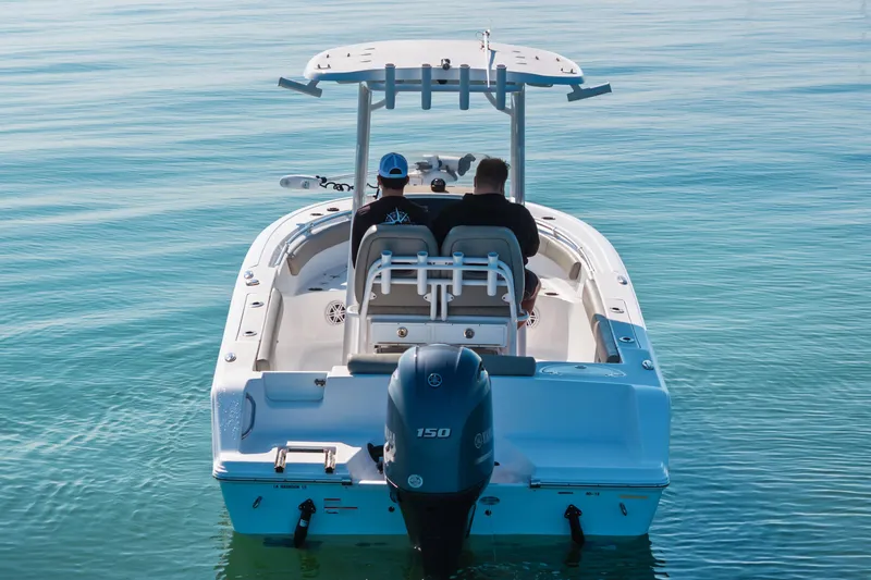 Slide: The Image of 2021 Sportsman Open 212 Center Console boat on calm water, rear view. - 6