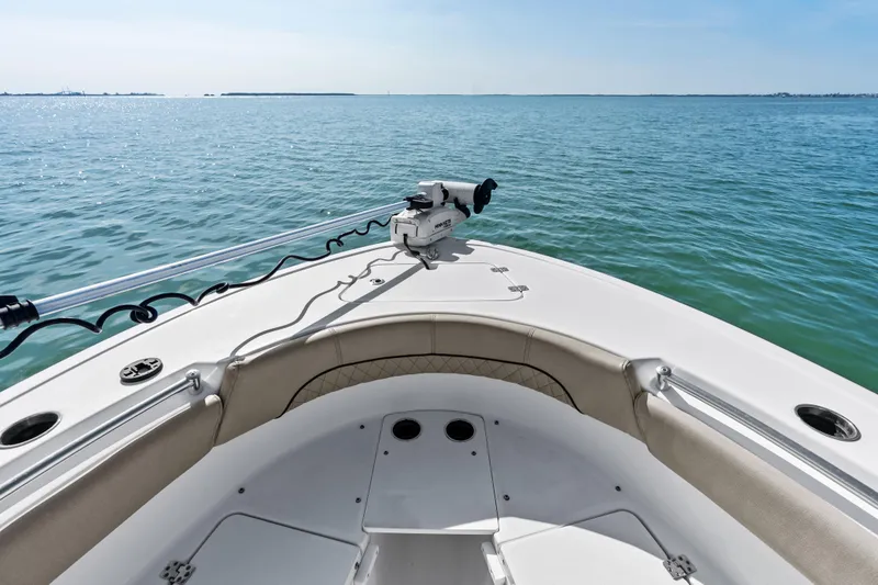 Slide: The Image of 2021 Sportsman Open 212 Center Console boat on calm ocean waters. - 7