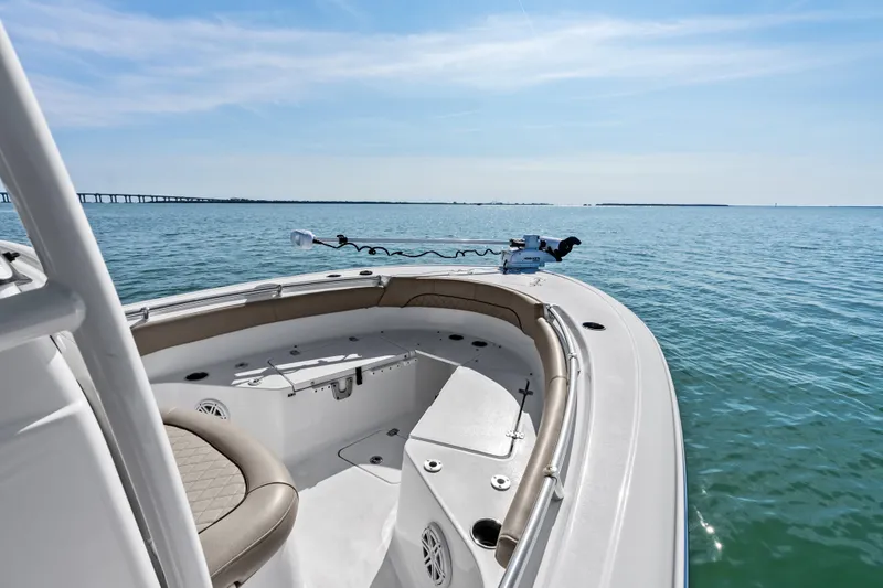 Slide: The Image of 2021 Sportsman Open 212 Center Console boat on calm ocean waters. - 8