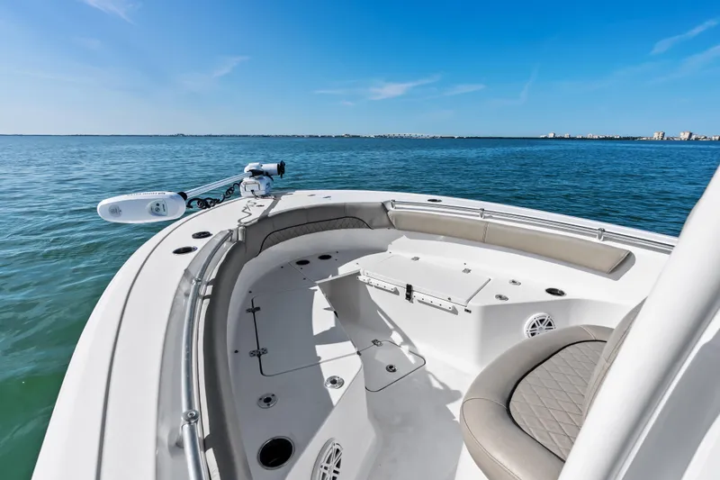 Slide: The Image of 2021 Sportsman Open 212 Center Console boat on calm blue water. - 9