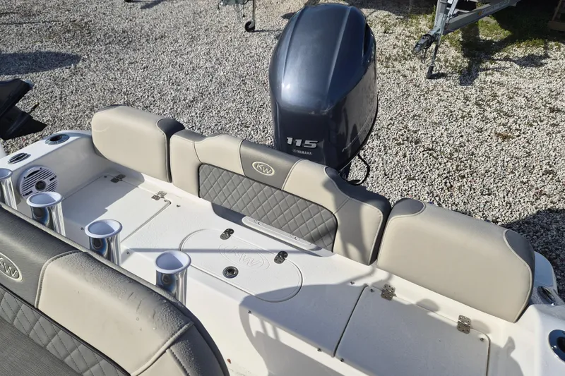 Slide: The Image of 2026 Key West 189 FS boat with Yamaha 115 engine, featuring cushioned seating and cup holders. - 8