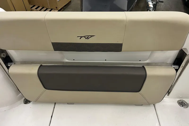 Slide: The Image of 2021 22 Tidewater Adventure boat seat with beige and brown upholstery. - 17