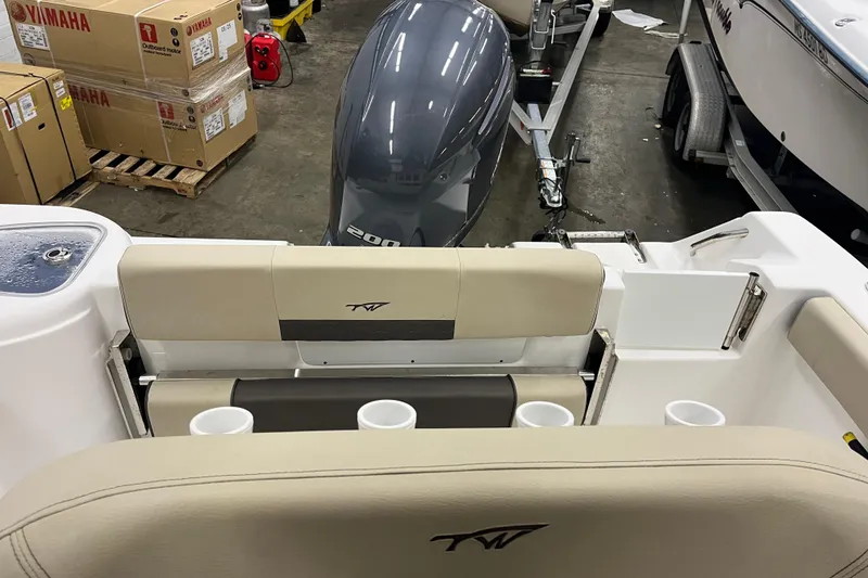 Slide: The Image of 2021 22 Tidewater Adventure boat interior with Yamaha engine and cup holders. - 18
