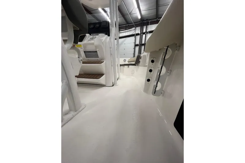 Slide: The Image of Interior view of 2021 22 Tidewater Adventure boat, showcasing seating and control panel. - 23