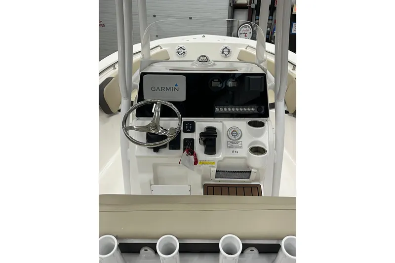 Slide: The Image of 2021 22 Tidewater Adventure boat console with Garmin navigation system and steering wheel. - 27