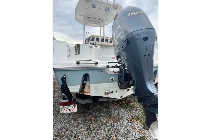 Slide: The Image of 2021 22 Tidewater Adventure boat with Yamaha 200 engine, parked on gravel. - 28