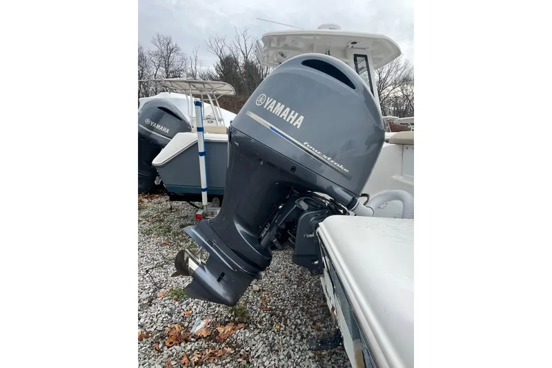Slide: The Image of 2021 22 Tidewater Adventure boat with Yamaha outboard motor on gravel. - 29