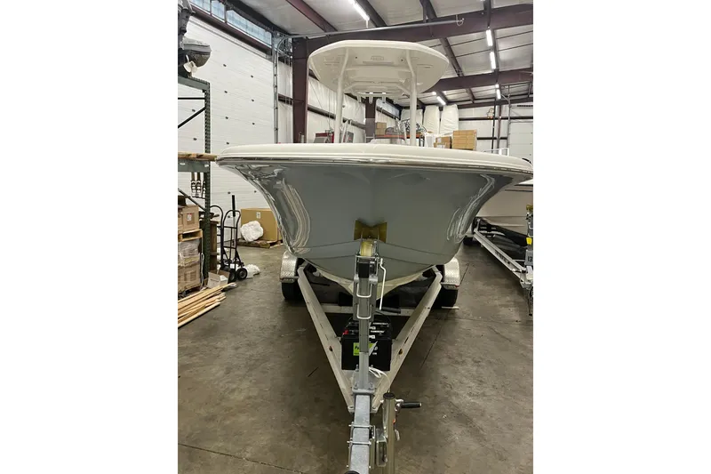 Slide: The Image of 2021 22 Tidewater Adventure boat on trailer in warehouse setting. - 3
