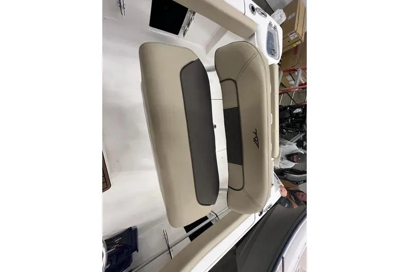 Slide: The Image of 2021 22 Tidewater Adventure boat seat, beige and black upholstery, interior view. - 7