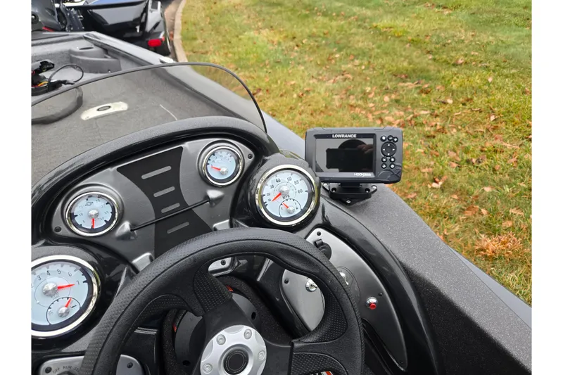 Slide: The Image of 2022 Tracker Pro Team 175 TF dashboard with gauges and Lowrance fish finder. - 14