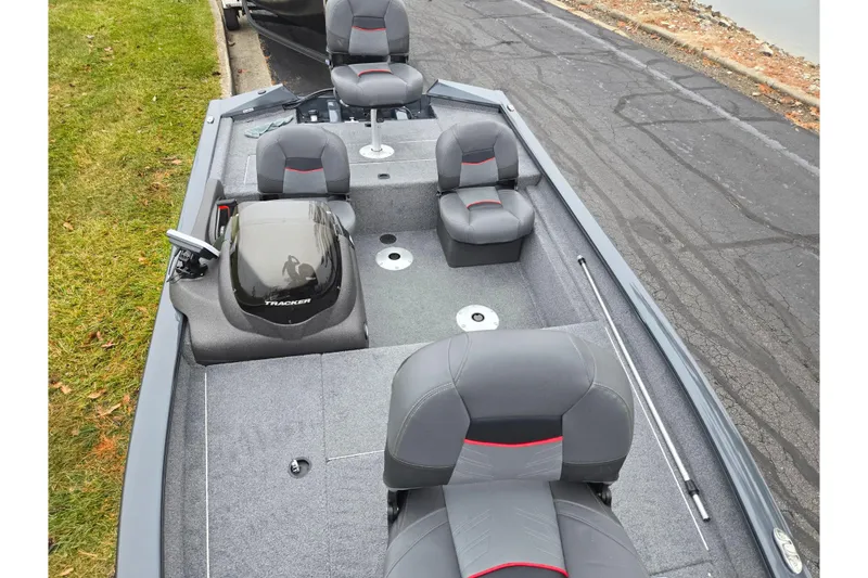 Slide: The Image of 2022 Tracker Pro Team 175 TF boat interior with gray seating and console. - 19