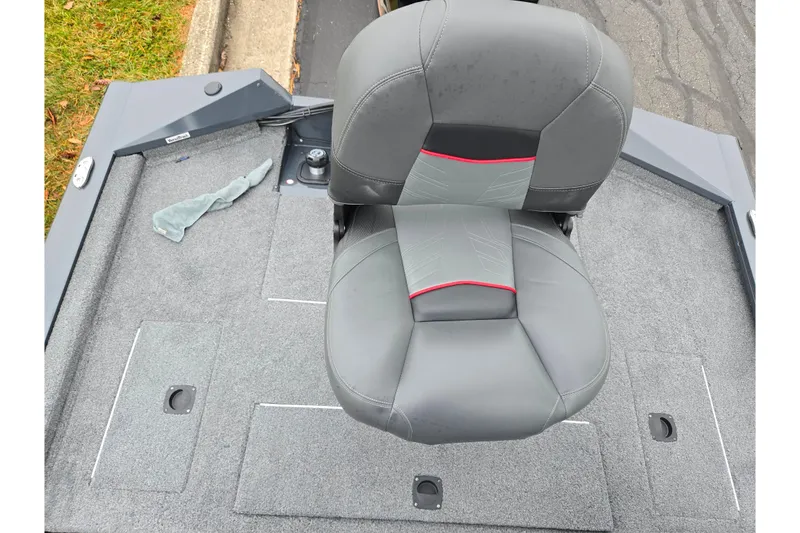 Slide: The Image of 2022 Tracker Pro Team 175 TF boat seat on carpeted deck. - 23