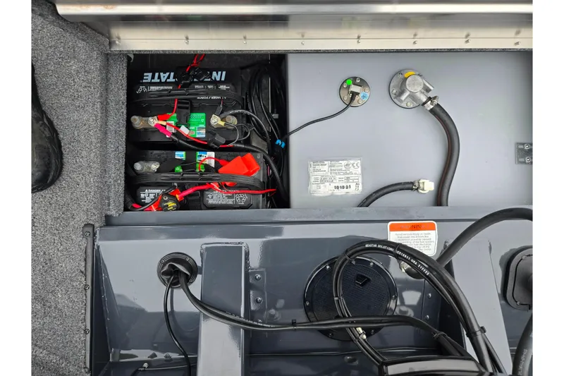 Slide: The Image of 2022 Tracker Pro Team 175 TF boat battery compartment with wiring and connections. - 24