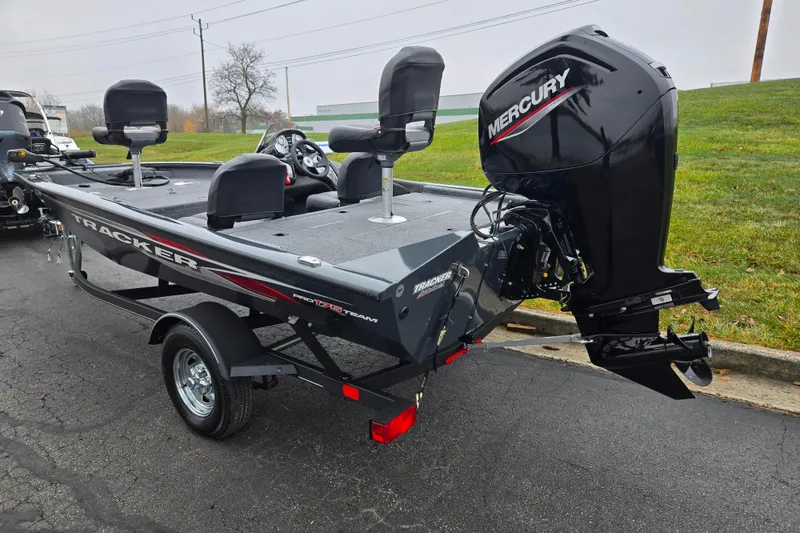Slide: The Image of 2022 Tracker Pro Team 175 TF fishing boat with Mercury outboard engine on a trailer. - 3