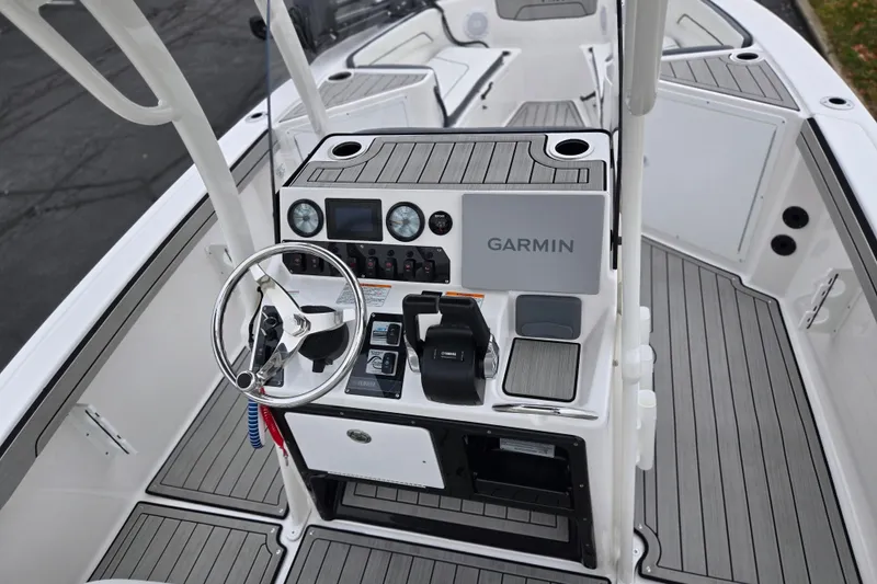 Slide: The Image of 2022 Yamaha Boats 210 FSH Sport dashboard with Garmin navigation system. - 12