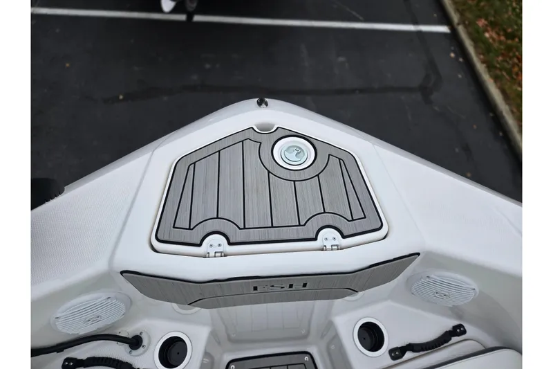 Slide: The Image of 2022 Yamaha Boats 210 FSH Sport bow storage compartment with sleek design and modern features. - 21