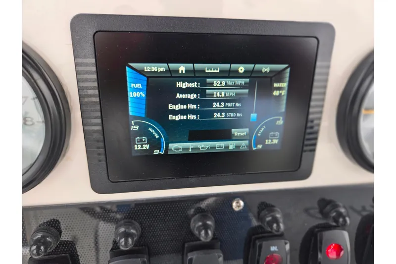 Slide: The Image of Yamaha Boats 2022 210 FSH Sport dashboard display showing fuel, speed, and engine hours. - 29