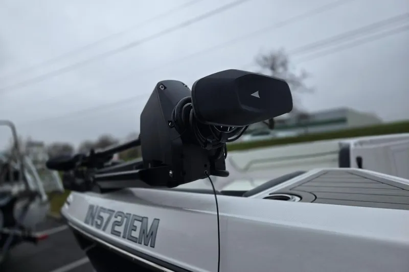Slide: The Image of 2022 Yamaha Boats 210 FSH Sport with advanced trolling motor, overcast background. - 5