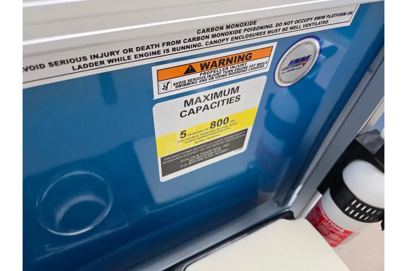 Slide: The Image of Warning label on 2023 Avalon Venture CR 1575 boat, indicating maximum capacity and safety instructions. - 14