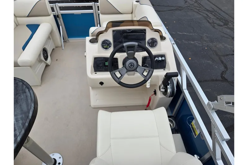 Slide: The Image of 2023 Avalon Venture CR 1575 boat interior with steering console and seating. - 19