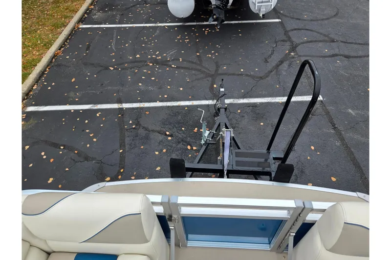 Slide: The Image of 2023 Avalon Venture CR 1575 boat on trailer in parking lot. - 21