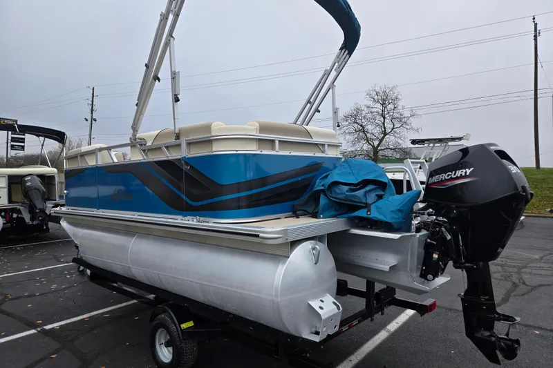 Slide: The Image of 2023 Avalon Venture CR 1575 pontoon boat with Mercury outboard motor in parking lot. - 3