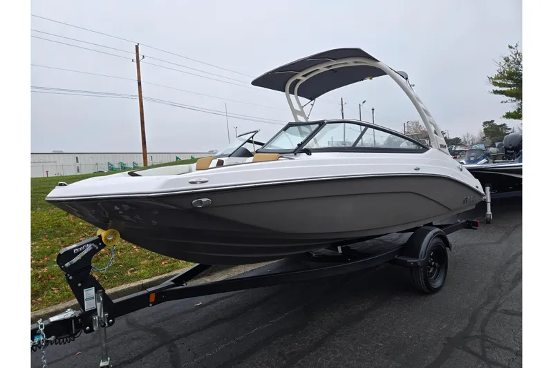 Slide: The Image of 2023 Yamaha Boats 195S on trailer, sleek design, overcast day. - 5