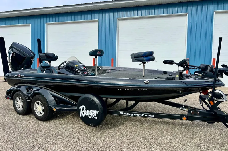 The Image of 2017 Ranger Z519 boat with trailer, parked outside blue garage doors. - 0