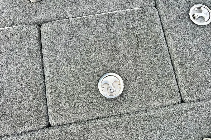 Slide: The Image of Gray carpeted deck of 2017 Ranger Z519 boat with metal latches. - 16