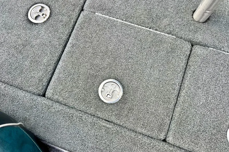 Slide: The Image of 2017 Ranger Z519 boat deck with storage compartments and metal latches. - 18